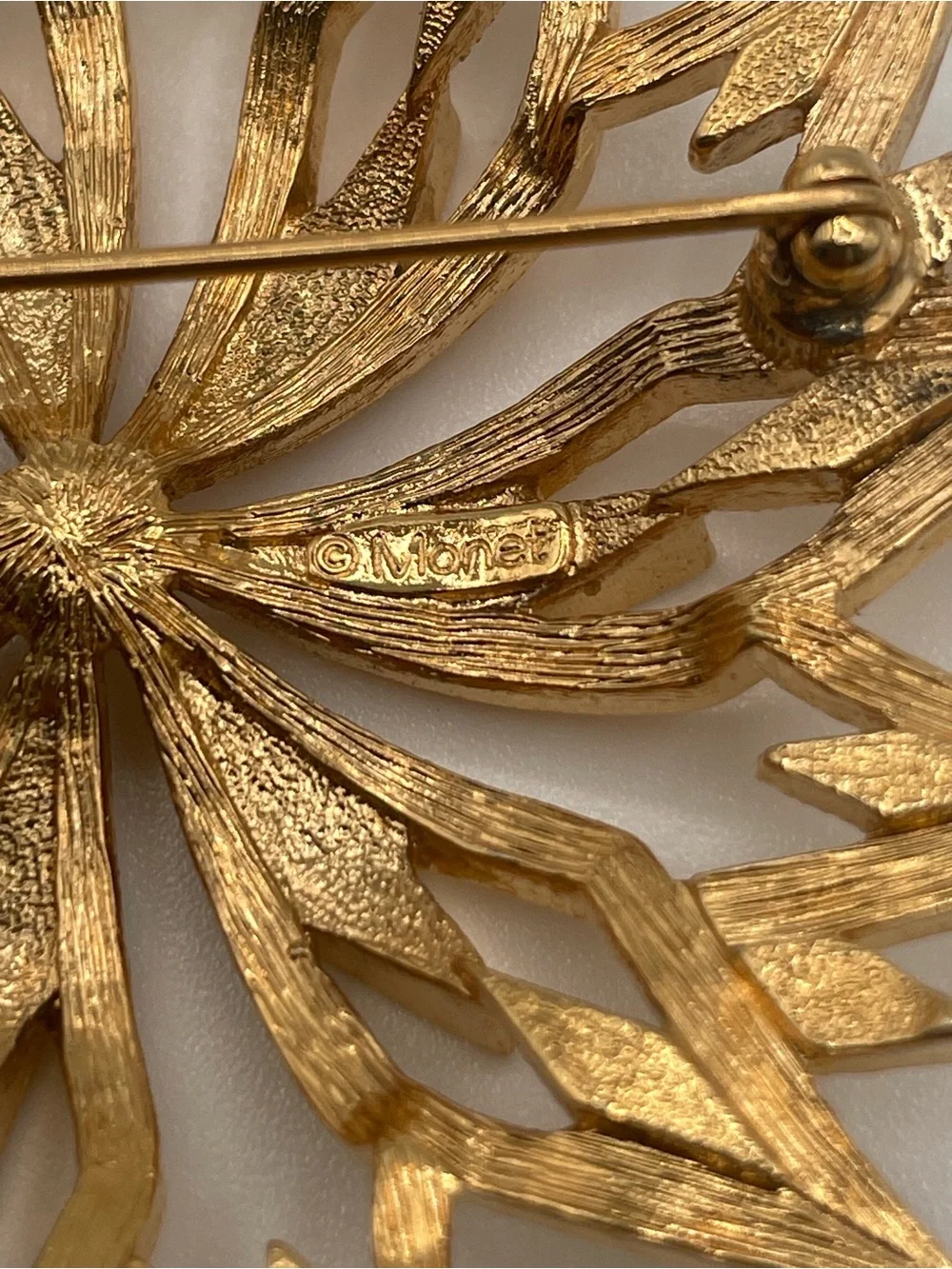 VTG Monet Gold Tone Starburst Floral Textured Brooch